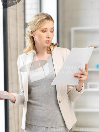 Image of calm woman with documents