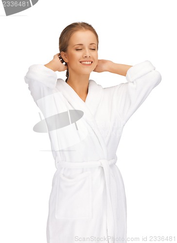 Image of beautiful woman in white bathrobe