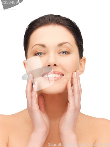 Image of face and hands of beautiful woman