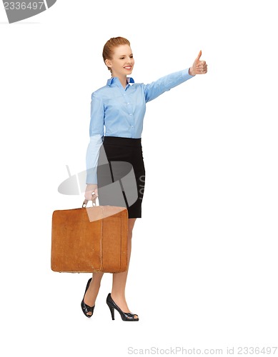 Image of hitch-hiking woman with suitcase