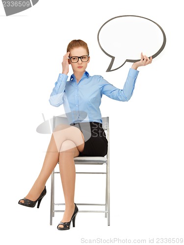 Image of pensive businesswoman with blank text bubble