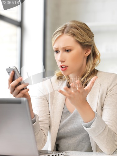 Image of businesswoman with cell phone