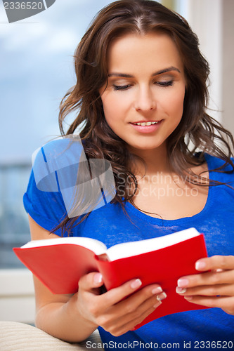 Image of happy and smiling woman with book