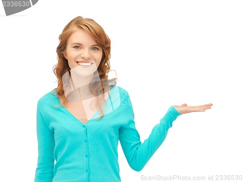 Image of girl showing something on the palm of her hand