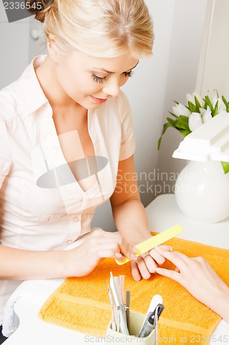 Image of woman having a manicure at the salon