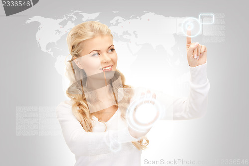 Image of businesswoman working with touch screen