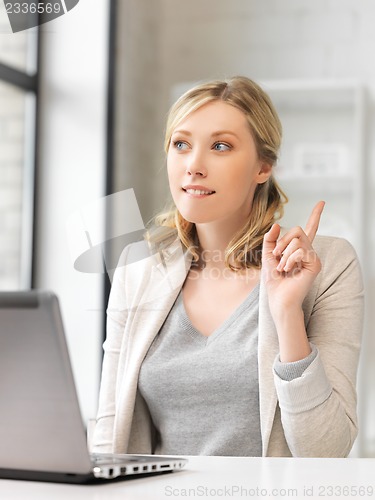 Image of woman with laptop and finger up