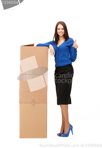 Image of businesswoman with big boxes