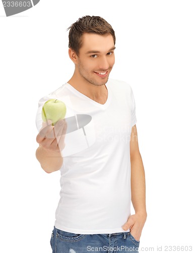 Image of man in white shirt with green apple