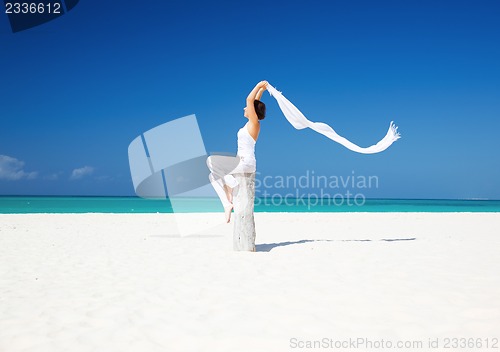 Image of happy woman on the beach