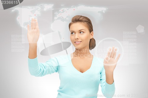 Image of businesswoman working with touch screen