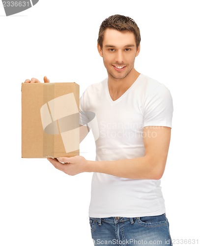 Image of handsome man with big box