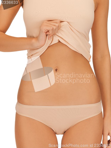 Image of woman body in beige cotton undrewear