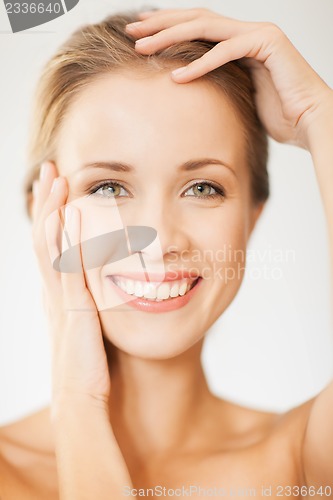 Image of face and hands of beautiful woman