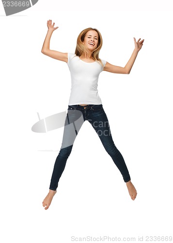 Image of jumping teenage girl in blank white t-shirt