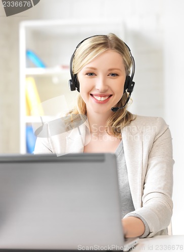 Image of helpline operator with laptop computer