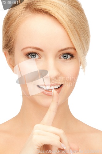 Image of woman with finger on lips
