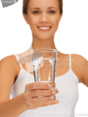 Image of woman hands holding glass of water