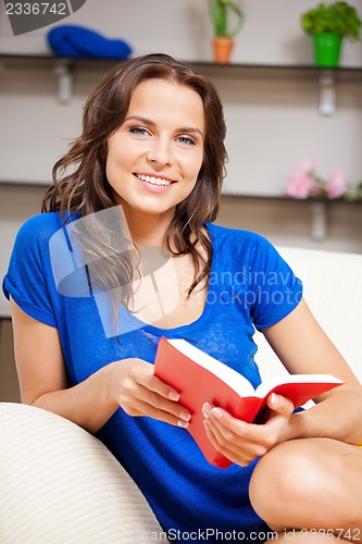Image of happy and smiling woman with book