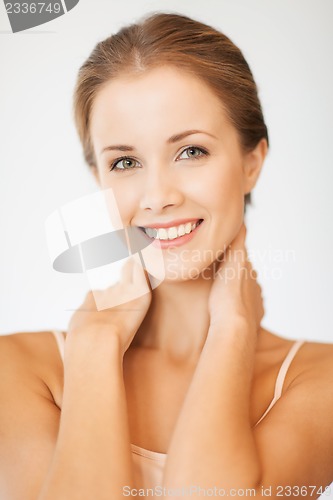 Image of face and hands of beautiful woman