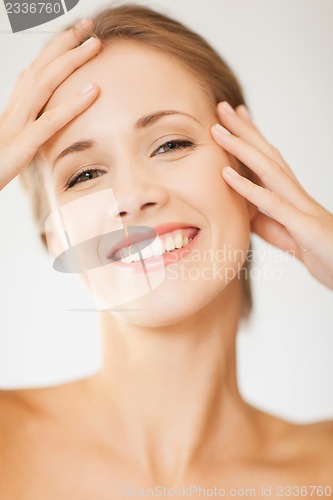 Image of face and hands of beautiful woman