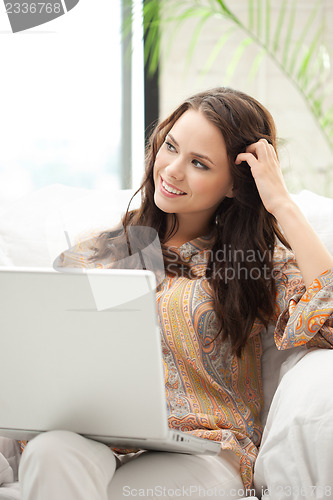 Image of happy woman with laptop computer