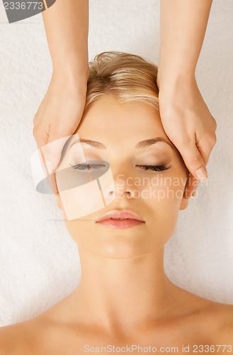 Image of beautiful woman in massage salon