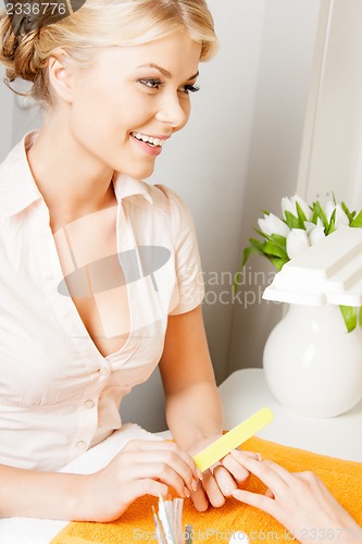 Image of woman having a manicure at the salon