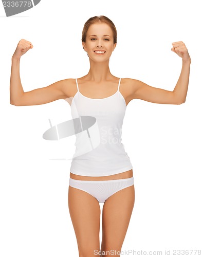 Image of woman in cotton undrewear flexing her biceps