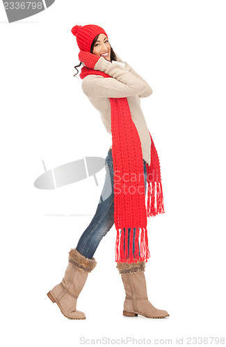 Image of beautiful woman in hat, muffler and mittens