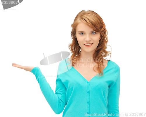 Image of girl showing something on the palm of her hand