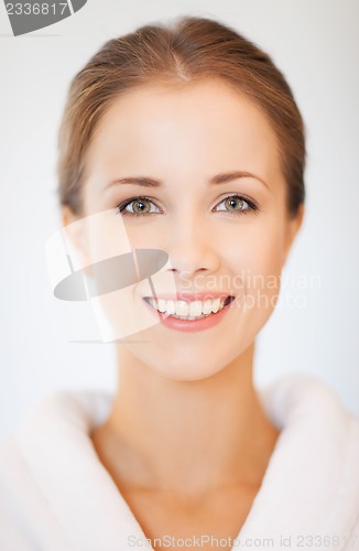 Image of beautiful woman in bathrobe