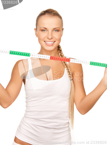 Image of young beautiful woman with measure tape