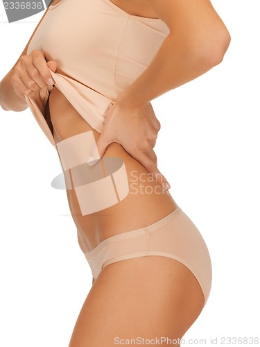 Image of woman body in beige cotton undrewear