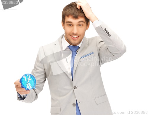 Image of handsome man with clock