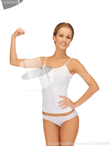 Image of woman in cotton undrewear flexing her biceps