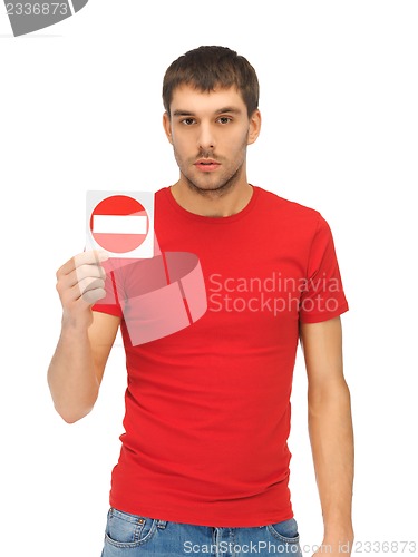 Image of man holding no entry sign