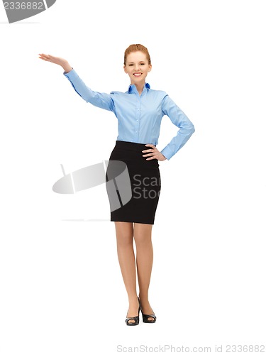 Image of smiling stewardess showing direction