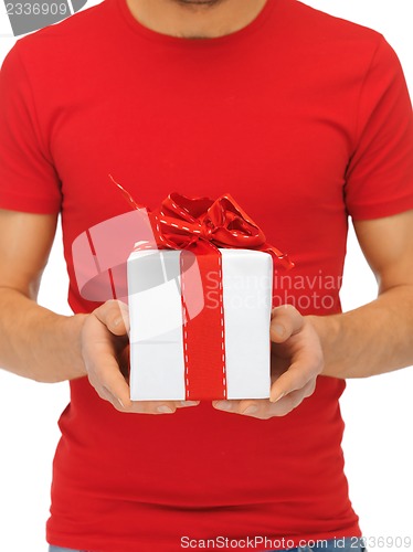 Image of man's hands holding gift box