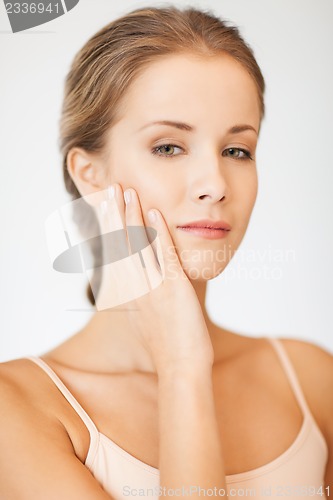 Image of face and hands of beautiful woman