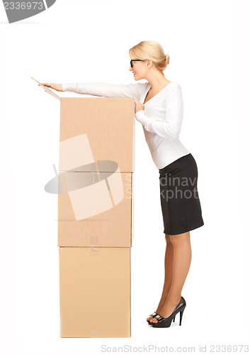 Image of businesswoman with big boxes