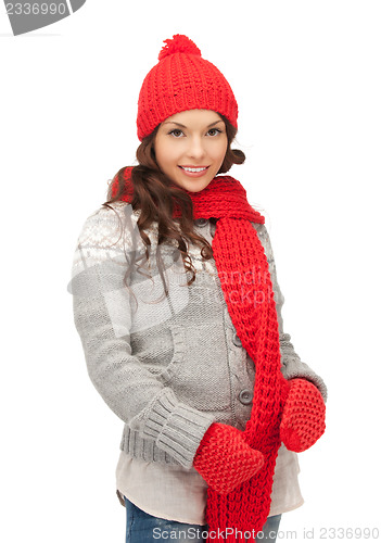 Image of beautiful woman in hat, muffler and mittens