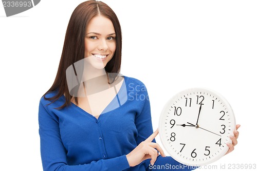 Image of woman holding big clock