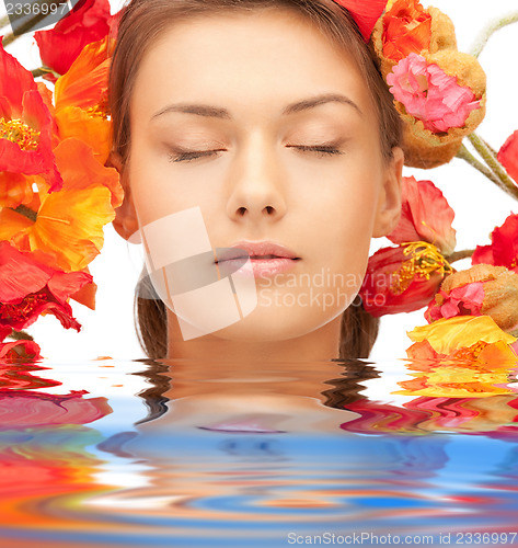 Image of lovely woman with red flowers