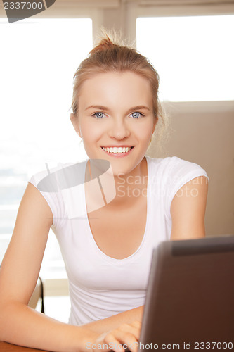 Image of happy teenage girl with laptop computer