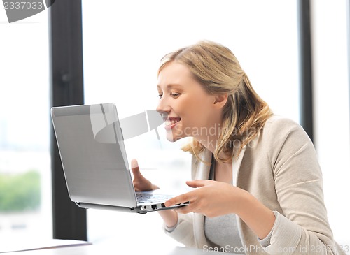 Image of happy woman with laptop computer