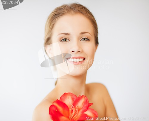 Image of lovely woman with lily flower