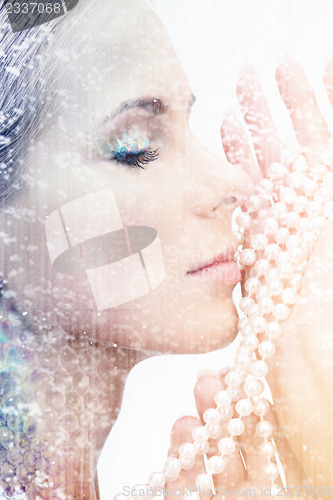 Image of beautiful woman with pearl beads
