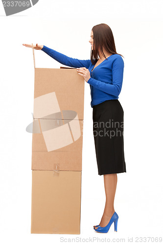 Image of businesswoman with big boxes