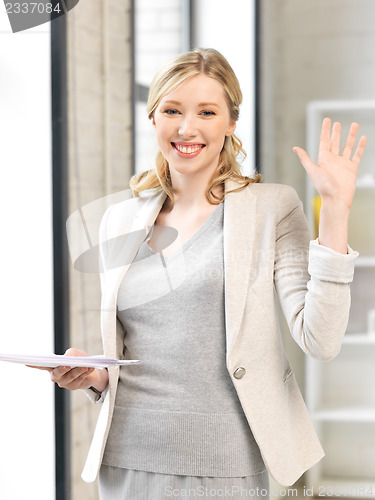 Image of happy woman with documents